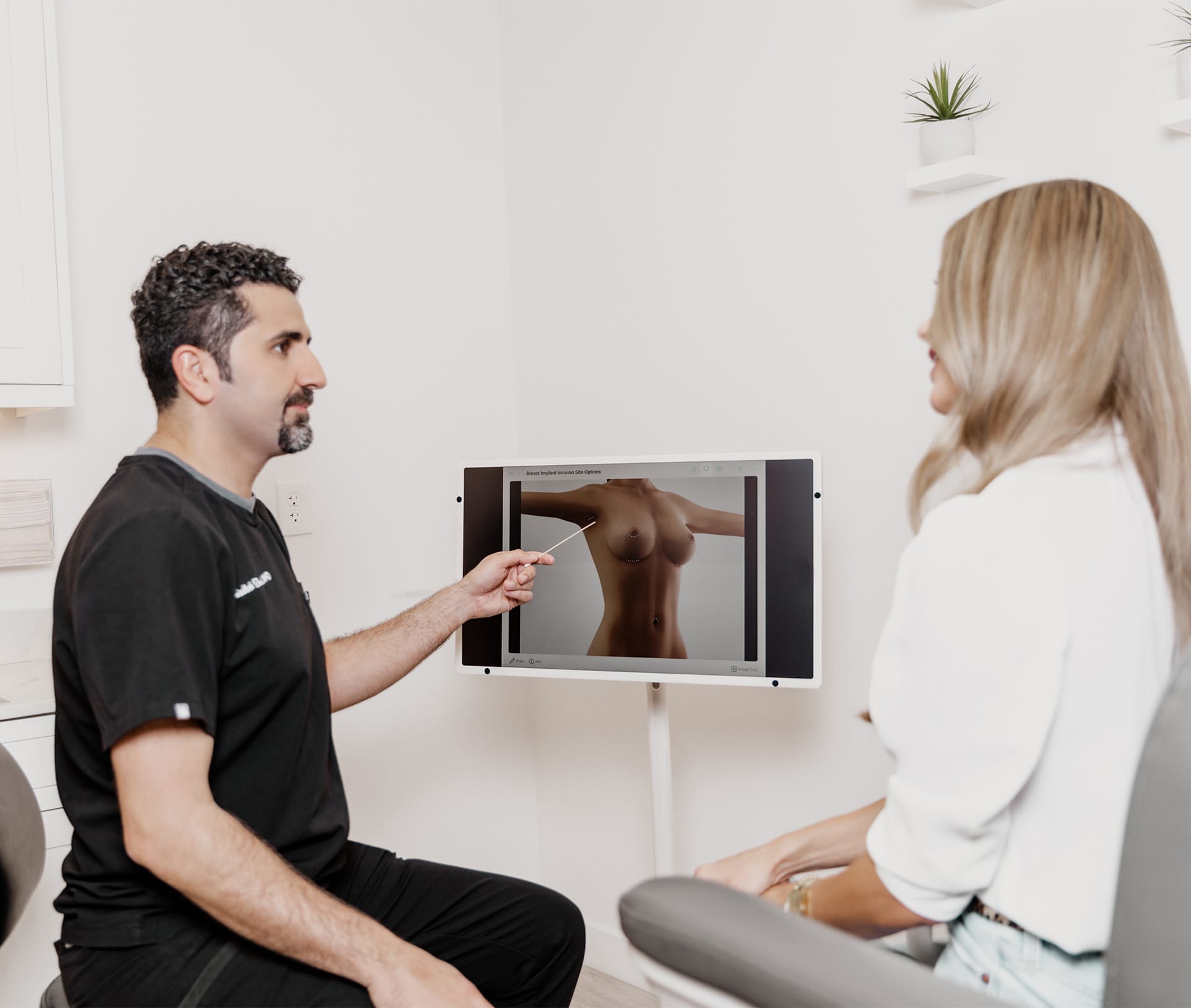 doctor pointing to a screen