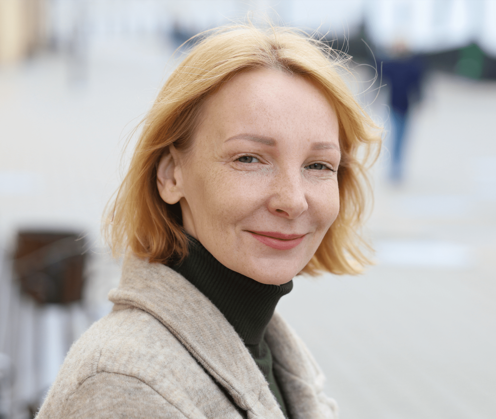woman with short blonde hair smiling