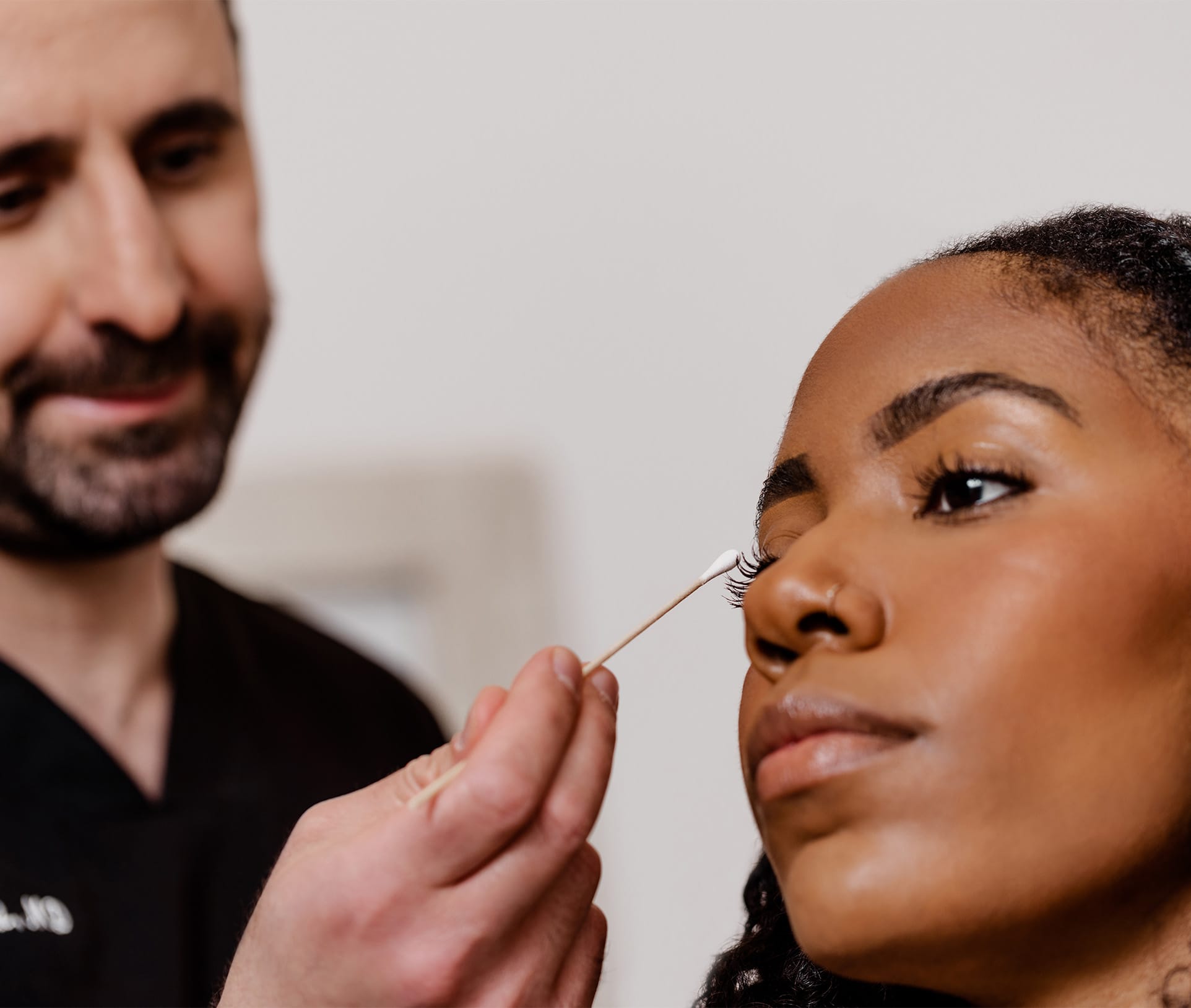 doctor pointing to a patient's eyelid