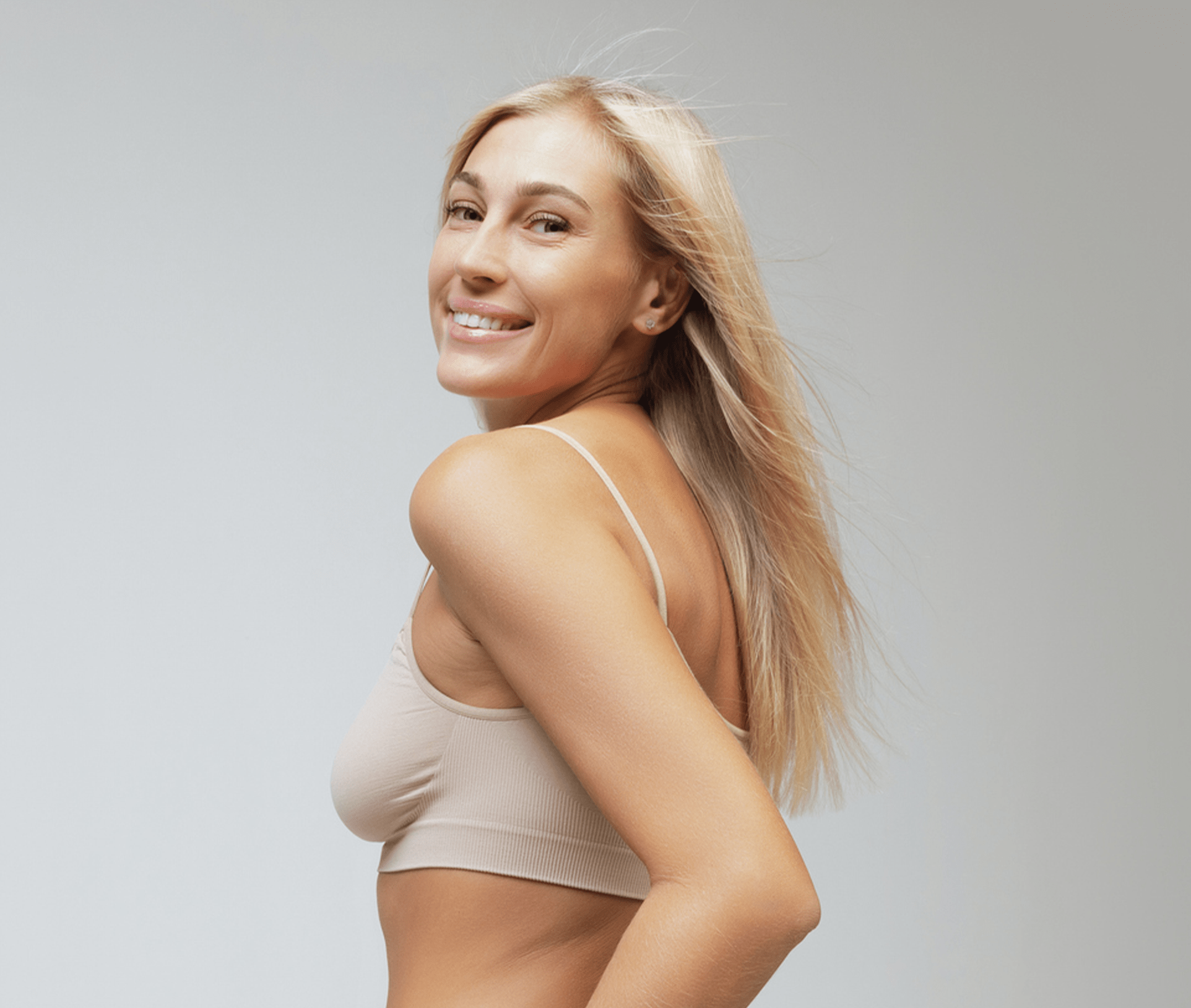 woman looking over her shoulder smiling