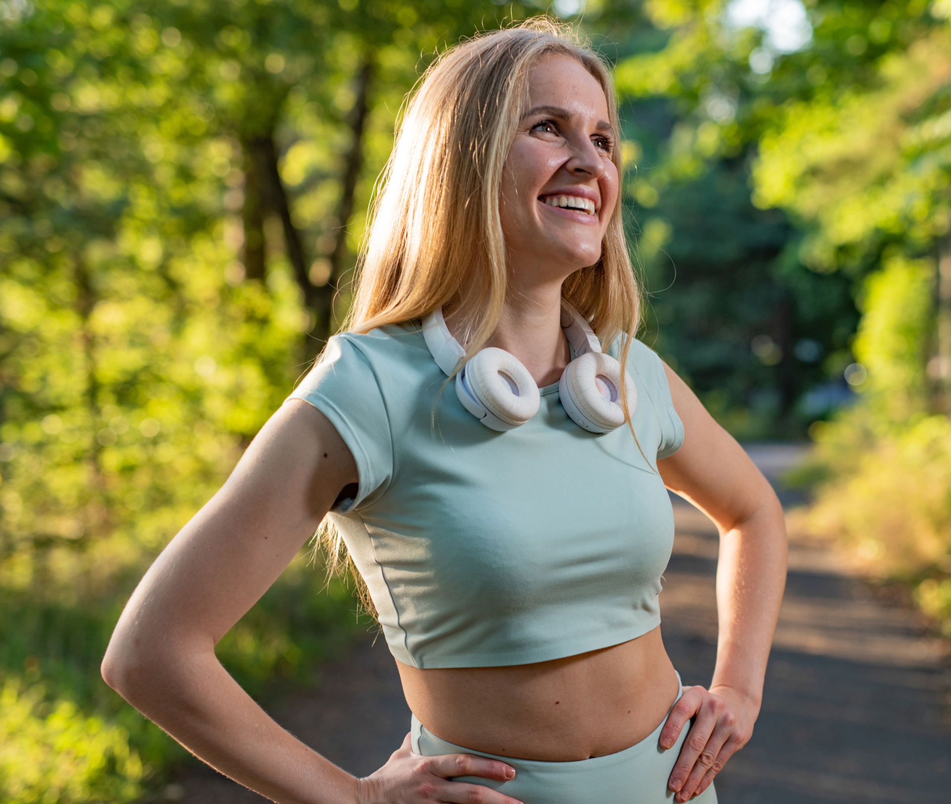 smiling woman with her hands on her hips